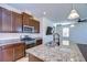 Well-equipped kitchen boasts granite countertops, stainless steel appliances, and ample cabinet space at 11117 Abaco Island Ave, Riverview, FL 33579