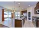 Modern kitchen features a large island, stainless steel appliances, and granite countertops at 11117 Abaco Island Ave, Riverview, FL 33579