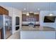 Modern kitchen features a large island, stainless steel appliances, and granite countertops at 11117 Abaco Island Ave, Riverview, FL 33579