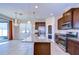 Modern kitchen features a large island, stainless steel appliances, and granite countertops at 11117 Abaco Island Ave, Riverview, FL 33579