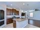 Modern kitchen features a large island, stainless steel appliances, and granite countertops at 11117 Abaco Island Ave, Riverview, FL 33579