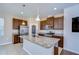 Modern kitchen features a large island, stainless steel appliances, and granite countertops at 11117 Abaco Island Ave, Riverview, FL 33579