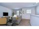 Cozy upstairs living room featuring neutral paint, plush seating, and natural light, creating an inviting atmosphere at 11117 Abaco Island Ave, Riverview, FL 33579