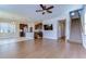 Spacious living room features hardwood floors, a ceiling fan, and an open concept leading to the kitchen at 11117 Abaco Island Ave, Riverview, FL 33579
