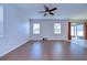 An empty living room with abundant natural light and beautiful laminate flooring at 11117 Abaco Island Ave, Riverview, FL 33579