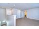 Bright upstairs loft featuring carpet flooring, access to multiple bedrooms, and recessed ceiling lights at 11117 Abaco Island Ave, Riverview, FL 33579