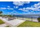 Scenic water view from the community patio with tables and chairs for residents at 11117 Abaco Island Ave, Riverview, FL 33579