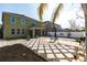 Spacious backyard with patio, unique stone pattern, and room for outdoor entertaining at 11539 Tangle Branch Ln, Gibsonton, FL 33534