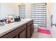 Bathroom featuring a granite countertop vanity and a shower with striped curtain at 11539 Tangle Branch Ln, Gibsonton, FL 33534
