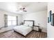 Inviting bedroom with a comfortable bed, floral curtains, and ample natural light from the window at 11539 Tangle Branch Ln, Gibsonton, FL 33534