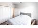 Simple bedroom featuring a bed, closet, and a view into the hallway at 11539 Tangle Branch Ln, Gibsonton, FL 33534
