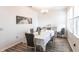 Elegant dining room with a floral tablecloth, gray chairs, and decorative accents, creating a refined atmosphere at 11539 Tangle Branch Ln, Gibsonton, FL 33534