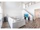 Bright living room boasting high ceilings, hardwood floors, contemporary furnishings, and a staircase leading to the second floor at 11539 Tangle Branch Ln, Gibsonton, FL 33534