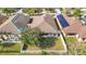 Aerial view of the backyard with white picket fence and patio area at 12222 Legacy Bright St, Riverview, FL 33578