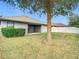 Backyard view featuring a patio, lush lawn, and privacy fence, perfect for outdoor enjoyment at 12222 Legacy Bright St, Riverview, FL 33578