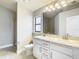 The bathroom features a double sink vanity with white cabinets and stone countertop at 12222 Legacy Bright St, Riverview, FL 33578