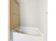 This bathroom features a soaking tub with chrome fixtures at 12222 Legacy Bright St, Riverview, FL 33578