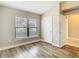 Neutral room featuring wood floors and a window with great natural light at 12222 Legacy Bright St, Riverview, FL 33578