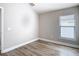 Neutral room featuring wood floors and a window with great natural light at 12222 Legacy Bright St, Riverview, FL 33578