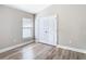 Neutral room featuring wood floors and a window with great natural light at 12222 Legacy Bright St, Riverview, FL 33578