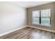 Neutral room featuring wood floors and a window with great natural light at 12222 Legacy Bright St, Riverview, FL 33578