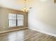 Dining room featuring a modern chandelier and a large window at 12222 Legacy Bright St, Riverview, FL 33578