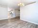 Bright dining room with wood-look floors adjacent to the kitchen at 12222 Legacy Bright St, Riverview, FL 33578