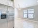 Dining area with stainless steel refrigerator and adjacent to the kitchen at 12222 Legacy Bright St, Riverview, FL 33578