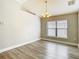 Bright dining area with modern light fixture and wood-look floors at 12222 Legacy Bright St, Riverview, FL 33578