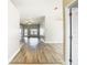 Open-concept floor plan showcasing the transition from the entryway to the spacious living area with hardwood floors at 12222 Legacy Bright St, Riverview, FL 33578