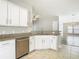 Bright kitchen featuring granite counters, stainless steel appliances, and modern white cabinetry at 12222 Legacy Bright St, Riverview, FL 33578