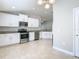 Spacious kitchen featuring stainless steel appliances and white cabinets at 12222 Legacy Bright St, Riverview, FL 33578