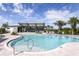 Beautiful community pool with zero entry, metal handrail, and adjacent clubhouse at 12352 49Th E St, Parrish, FL 34219