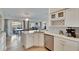 Kitchen featuring stainless steel appliances, wine rack, granite countertops, and breakfast nook at 12806 Yarn Pl, Riverview, FL 33569