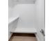 Modern closet featuring hardwood floors and built in shelving at 13330 88Th Pl, Seminole, FL 33776