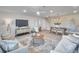 Bright and spacious living room featuring neutral tones, modern lighting, and an open-concept design at 13330 88Th Pl, Seminole, FL 33776
