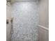 Walk-in shower exhibiting neutral-toned tile and contemporary fixtures at 13330 88Th Pl, Seminole, FL 33776