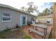 Backyard featuring a wood deck with an outdoor dining table and chairs at 1773 Ezelle Ave, Largo, FL 33770
