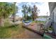 Backyard featuring a wood deck with two hammocks and lawn furniture at 1773 Ezelle Ave, Largo, FL 33770