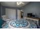 Bedroom featuring a blue-themed bed, closet and a TV on a rustic console table at 1773 Ezelle Ave, Largo, FL 33770
