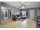 Comfortable living room with tile flooring, gray walls, and modern furnishings at 1773 Ezelle Ave, Largo, FL 33770