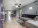 Open living space with tile floors, gray walls, ceiling fan, and contemporary furnishings at 1773 Ezelle Ave, Largo, FL 33770