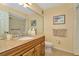 Bathroom featuring neutral colored walls, granite counter top and updated fixtures at 1801 E Lake Rd # 11A, Palm Harbor, FL 34685