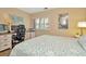 Inviting bedroom featuring a built in desk area, white plantation shutters and soft, neutral colored walls at 1801 E Lake Rd # 11A, Palm Harbor, FL 34685