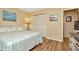 Inviting bedroom with closet, wood floors and soft neutral colored walls at 1801 E Lake Rd # 11A, Palm Harbor, FL 34685