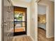 Inviting entryway with a view of a bedroom, showcasing hardwood floors and natural light at 1801 E Lake Rd # 11A, Palm Harbor, FL 34685