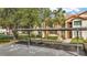 Exterior shot of building featuring covered parking at 1801 E Lake Rd # 11A, Palm Harbor, FL 34685