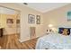 Hallway featuring wood floors, bathroom access and closet at 1801 E Lake Rd # 11A, Palm Harbor, FL 34685