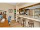Open kitchen area with granite countertops, stainless appliances, and a breakfast bar with seating at 1801 E Lake Rd # 11A, Palm Harbor, FL 34685