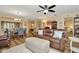 Living room featuring wood floors, comfortable seating, and view into dining area at 1801 E Lake Rd # 11A, Palm Harbor, FL 34685